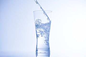 pouring water into glass