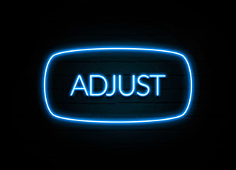 Adjust  - colorful Neon Sign on brickwall