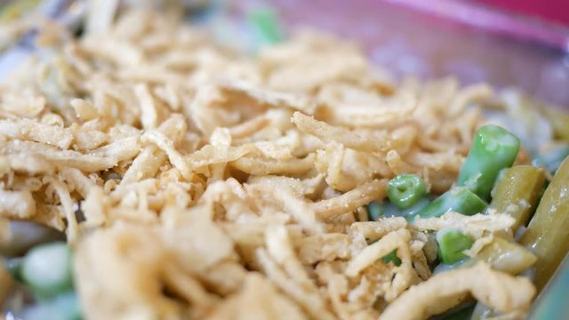 French Fried Onions sprinkled on green bean casserole recipe in cafe