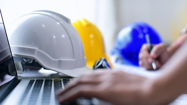Engineer Architect working table with safety helmet