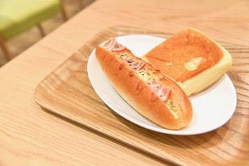 Plate of Breads Isolated on a Wooden Table