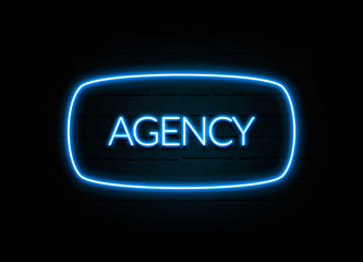 Agency  - colorful Neon Sign on brickwall