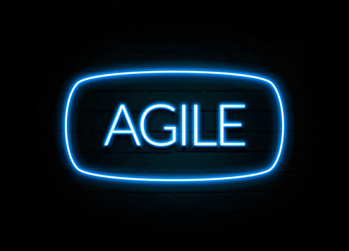 Agile  - colorful Neon Sign on brickwall