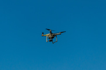 Fototapeta na wymiar White drone in blue sky