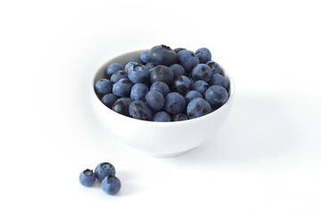 Fresh blueberries in a bowl isolated