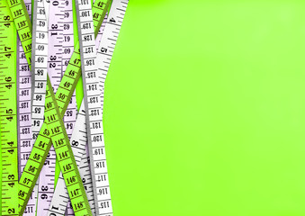 Diet control concept background. Colorful of Measuring tape on vibrant color  background.