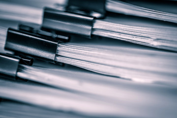 extreamly close up  the stacking of office working document with paper clip folder, vintage color tone