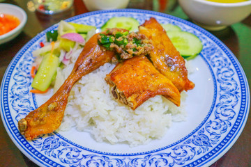 Grilled chicken on top with rice in Combodia style, selective focus
