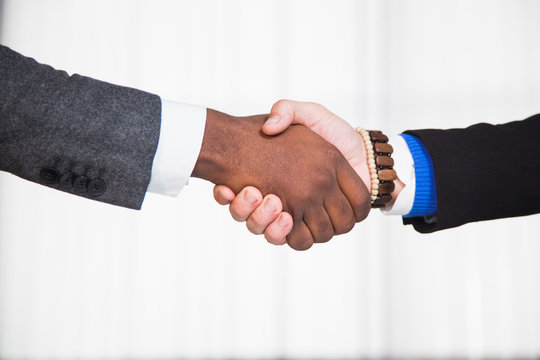 Businessmen shaking hands each other, partners agreemnet, business and office concept. Closeup shot