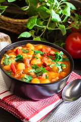 White bean soup with potatoes, tomatoes, paprika, and bacon