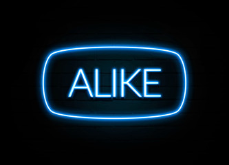 Alike  - colorful Neon Sign on brickwall