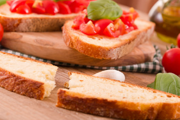 Bruschetta bread with basil and chopped tomatoes.
