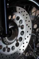 Motorcycle wheel disc brake background in modern scooter bike