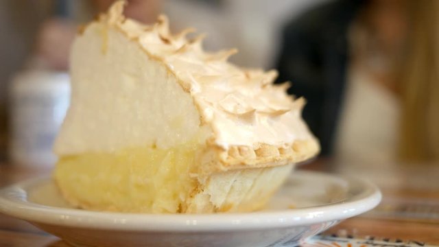 Close up shot of delicious coconut cream pie in a diner