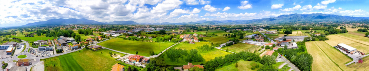 Fototapeta na wymiar Aerial panoramic view of Lucca Countryside. City and mountains, Tuscany - Italy