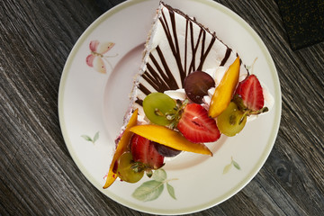 Slice of delicious tart with fresh fruits
