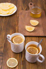 Composition with lemon tea on a wooden table