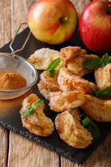 Deep fried sweet apples with cinnamon and sugar close-up. vertical