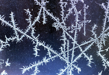 Frosty lines on the window in winter