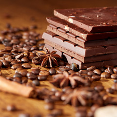 Aroma coffee chocolate cookies and spices on the wooden table. Dark wooden background. Top view. Close. Closeup.
