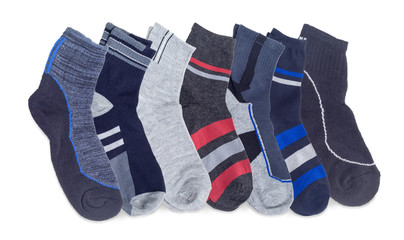 Several different men's socks on a white background