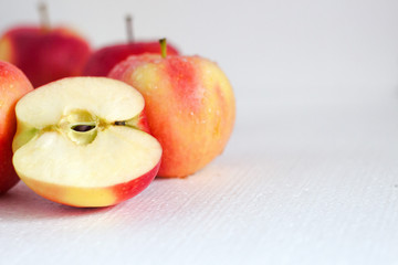 Red apple, half apple and quarter apple on white background. healthy food concept