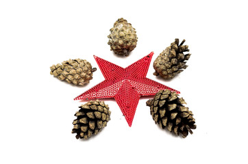 Cones of fir tree and toy decorative red star isolated on white background. Christmas decoration.