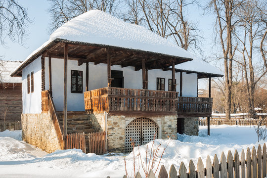 Old traditional Romanian house in winter at the Village Museum 'Dimitrie Gusti' in Bucharest