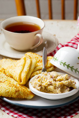 Blinis with herring butter. selective focus