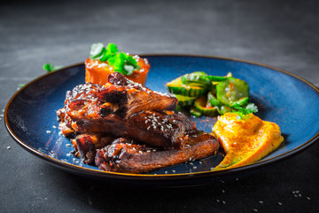 Tasty roasted ribs with sesame and vegetables