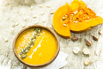 traditional autumn dish for Thanksgiving - pumpkin soup with garlic.