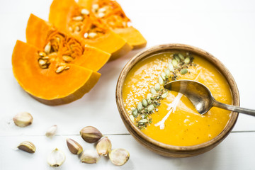 traditional autumn dish for Thanksgiving - pumpkin soup with garlic.
