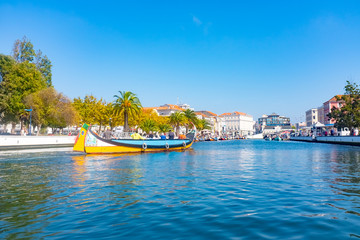 Fototapeta na wymiar Traditional boats on the canal in Aveiro, Portugal