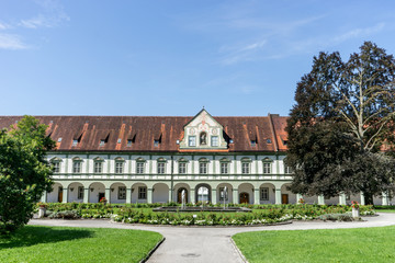 Fototapeta na wymiar baroque monastery / Benedictbeuern monastery in Bavaria, Germany with fountains and green areas