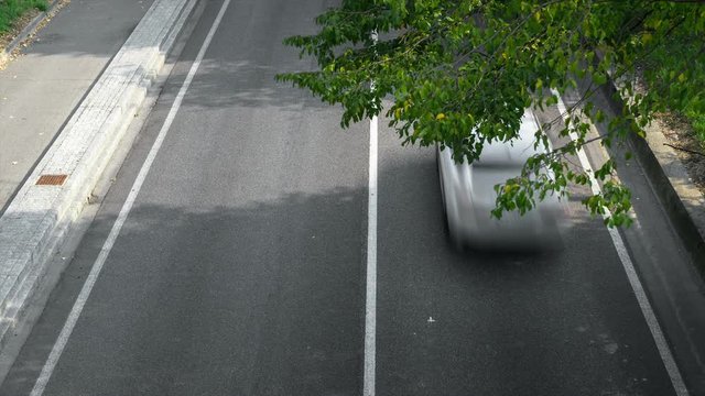 Time lapse. Motion blur of cars in aerial view over the road. (Speed limits - Infractions - Speed Cameras)