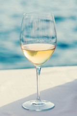 Glass of beer on the edge of the pool