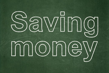 Finance concept: Saving Money on chalkboard background