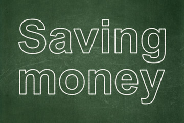 Fototapeta premium Finance concept: Saving Money on chalkboard background