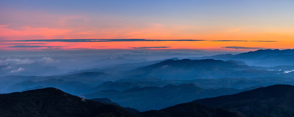Naklejka na ściany i meble Panoramic view at valley on early morning before sunrise from Sri Pada (Adam's Peak), Sri Lanka.