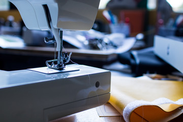 Detail of a white sewing machine. Need of a sewing machine