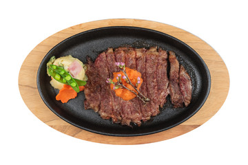 Isolated top view of medium rare wagyu steak topping with mince carrot on hot plate wooden plate  served with potato salad with ponzu sauce.