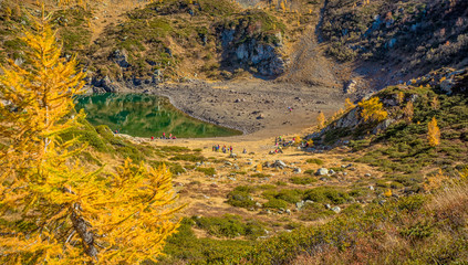 autumn view on the little lake of Erdemolo in Val dei Mocheni in Trentino Alto Adige