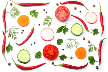 mix red hot chili peppers with parsley and sliced tomato isolated on white background top view