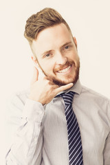 Smiling Business Man Making Call me Gesture