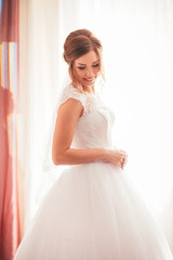 Fototapeta premium portrait of a young bride on a light background