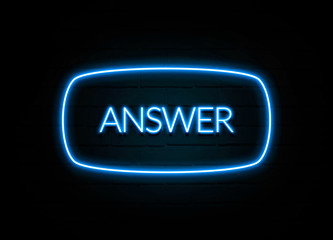 Answer  - colorful Neon Sign on brickwall