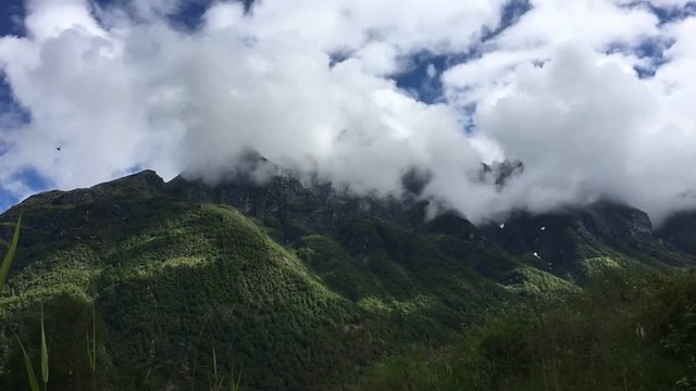Norwegian mountain timelapse with rolling clouds