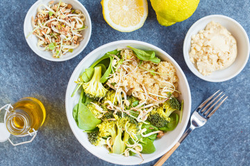 Buddha bowl with quinoa, broccoli and hummus.