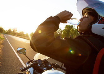 Driver Motorcycle drink water 