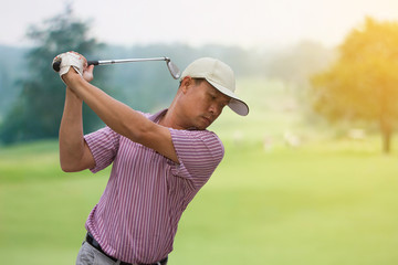 Golfers player golf hit swing shot on course in summer 